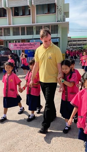 Thai elementary students walking to class
