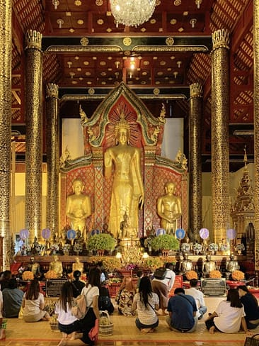 Praying at a Buddhist temple in Thailand