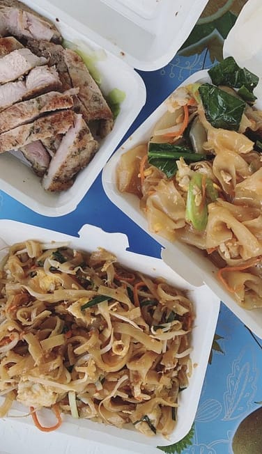 Thai food from a night market: pad thai and pad see ew
