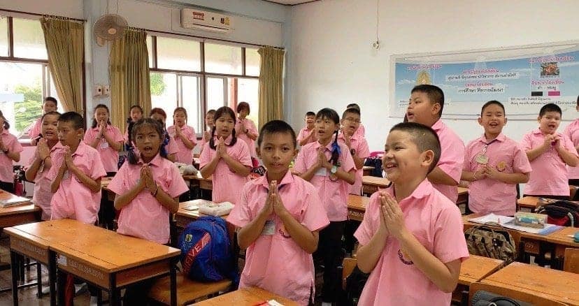 Elementary students in Thailand thanking their English teacher after class