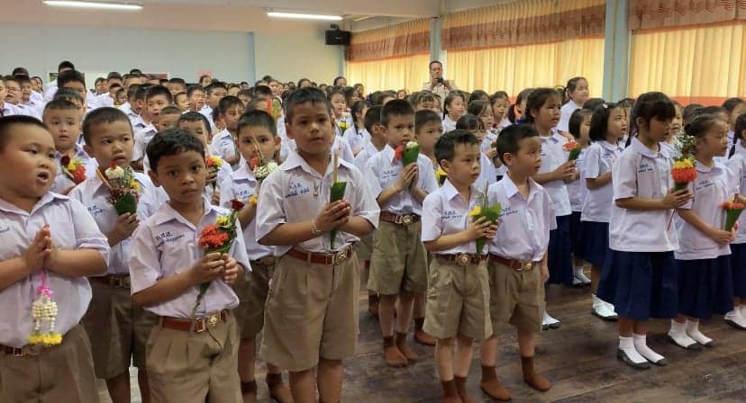 Elementary students in Thailand at a Teacher's Day assembly