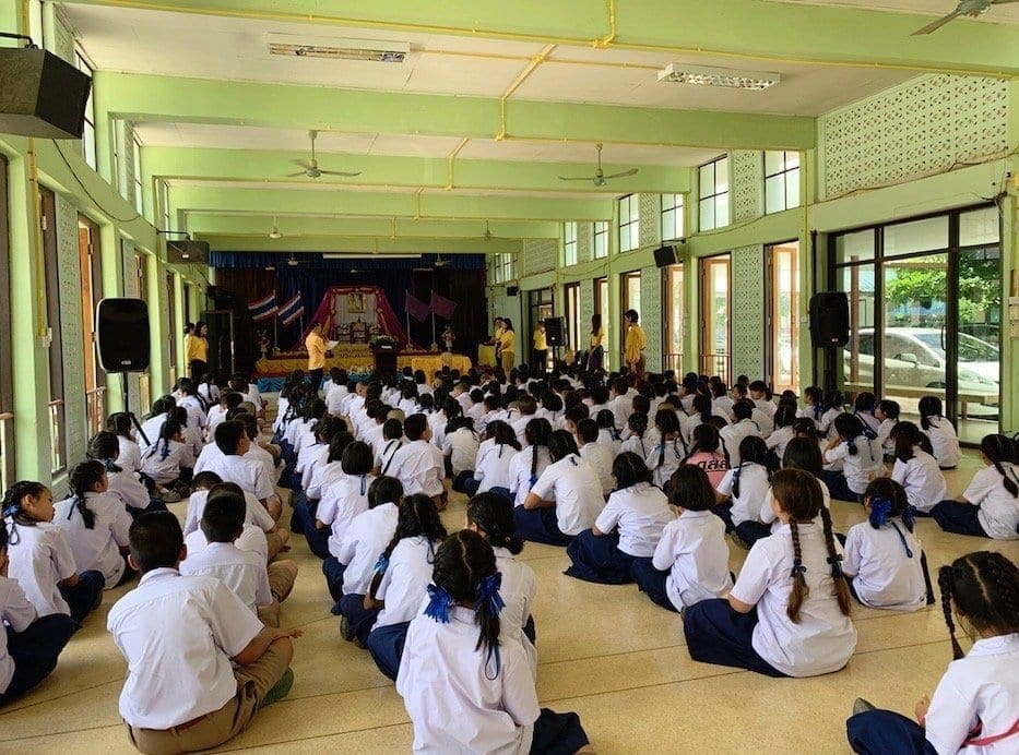 Elementary students in Thailand sitting at morning assembly